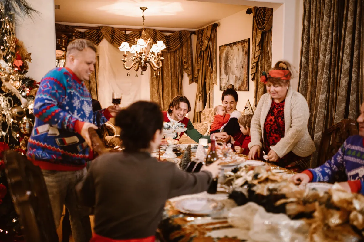 Family celebrating the 2026 holiday season at Christmas dinner
